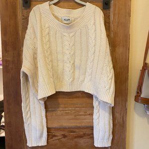 White cable-knit off the shoulder sweater